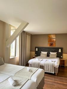 Appart'hotels HOTEL CERISE - LES SOURCES Luxeuil-les-Bains : photos des chambres
