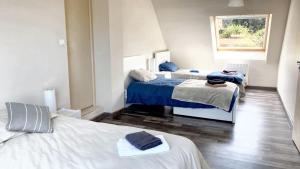 Maisons de vacances Maison moderne a Saint-Pol-de-Leon avec jardin prive : photos des chambres