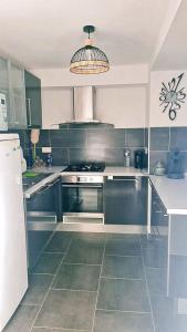 Appartements Appartement confortable a Raismes - 60 m², parking prive : photos des chambres