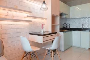 Warm and Homey 1BR at Brooklyn Alam Sutera Apartment By Travelio