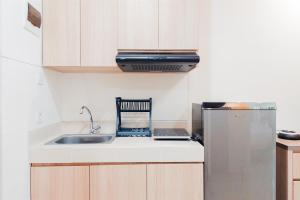 Homey and Modern Studio Apartment B Residence By Travelio