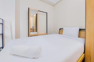 Homey and Modern Studio Apartment B Residence By Travelio