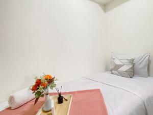 Warm and Homey 2BR at Meikarta Apartment By Travelio