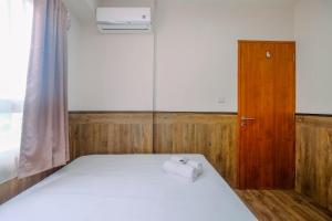 Minimalist and Comfy 2BR at Titanium Square Apartment By Travelio