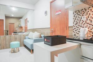 Minimalist and Comfy 2BR at Titanium Square Apartment By Travelio