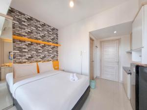 Homey and Good Studio Taman Melati Sinduadi Apartment By Travelio