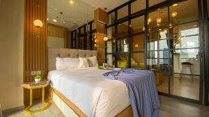 Nice and Homey 1BR at Sudirman Suites Apartment By Travelio