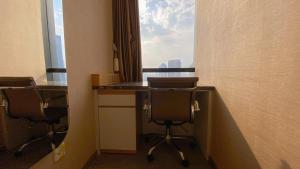 Nice and Homey 1BR at Sudirman Suites Apartment By Travelio