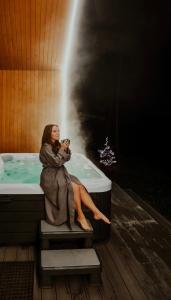 Sniegi design cabin with included sauna and jacuzzi