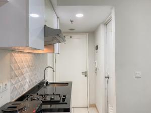 Cozy Living Studio with Direct Access to Pool and Gym at Springlake Summarecon Bekasi By Travelio