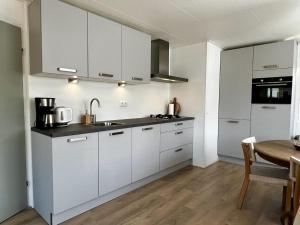 Bungalow in park with fenced garden