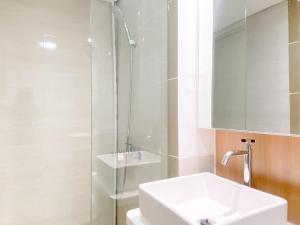 Spacious and Homey 2BR with Work Space at Meikarta Apartment By Travelio