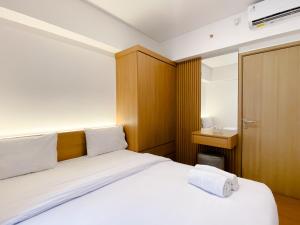 Spacious and Homey 2BR with Work Space at Meikarta Apartment By Travelio