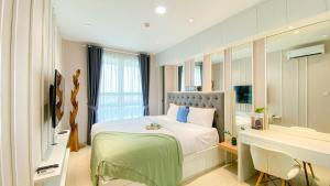 Fancy and Nice 1BR at Citralake Suites Apartment By Travelio
