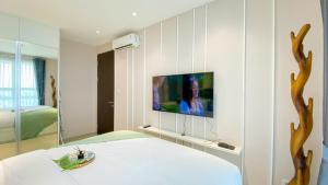 Fancy and Nice 1BR at Citralake Suites Apartment By Travelio