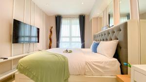 Fancy and Nice 1BR at Citralake Suites Apartment By Travelio