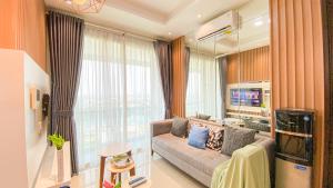 Fancy and Nice 1BR at Citralake Suites Apartment By Travelio