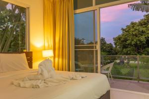 V129 Walking To Award winning Naiharn Beach 4BR