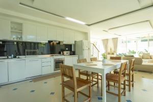 V129 Walking To Award winning Naiharn Beach 4BR