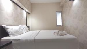 Comfortable Living 2BR at Dian Regency Apartment By Travelio