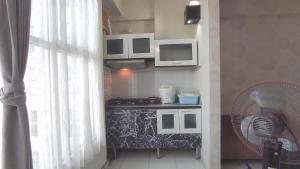 Comfortable Living 2BR at Dian Regency Apartment By Travelio