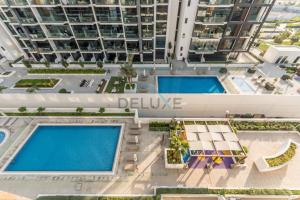 Pool Views 1BR Close to Major Landmarks in Azizi Riviera 18, Al Merkadh by Deluxe Holiday Homes
