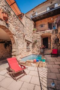 Maisons de vacances Maison en pierre avec bassin : photos des chambres