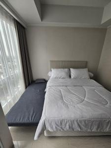 Green Sedayu Apartment Suite by Ellison