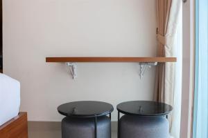 Restful 1BR without Living Room Grand Kamala Lagoon Apartment By Travelio