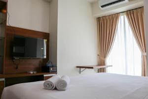 Restful 1BR without Living Room Grand Kamala Lagoon Apartment By Travelio