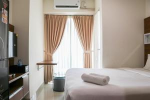 Restful 1BR without Living Room Grand Kamala Lagoon Apartment By Travelio