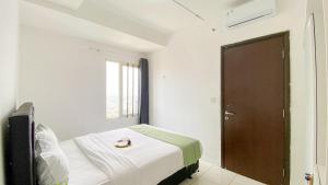 Brand New and Homey 1BR at Boutique Kemayoran Apartment By Travelio