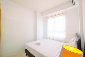 Comfort and Homey 2BR at Titanium Square Apartment By Travelio