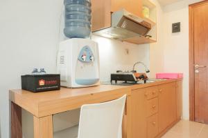 Cozy and Simply Studio Titanium Square Apartment By Travelio