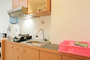 Cozy and Simply Studio Titanium Square Apartment By Travelio