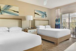 Three-Bedroom King Suite with Four Queen Beds and Sofa Bed room in Hilton Grand Vacations at SeaWorld