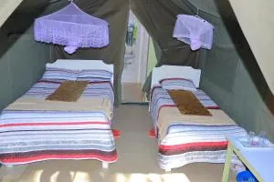 Rhino Tourist Camp - Ololaimutiek