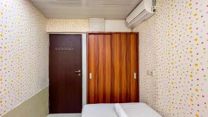 Cozy 2BR at Royal Makassar Apartment By Travelio