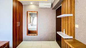 Cozy 2BR at Royal Makassar Apartment By Travelio