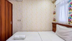 Cozy 2BR at Royal Makassar Apartment By Travelio