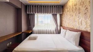 Cozy 2BR at Royal Makassar Apartment By Travelio
