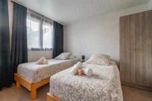 Appartements Les Coteaux 3 - Studio a 10min de Paris : photos des chambres