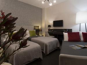 Standard Twin or Double Room with Sofa bed room in Hotel Atrium