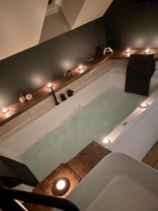 Appartements Les Secrets de la Baie - le Refuge - parenthese enchantee avec Spa privatif : photos des chambres