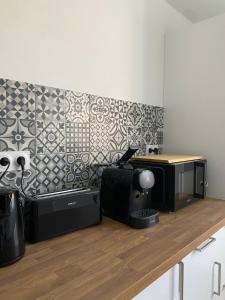 Appartements L-ecrin vert - Wifi - Netflix - Climatisation - Parking Gratuit : photos des chambres