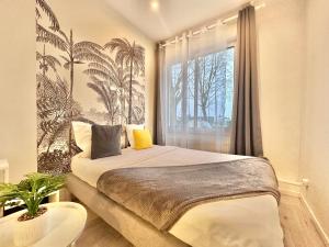 Appartements APPARTEMENT 2 chambres avec Jardinet, proche GARES : photos des chambres