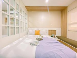 Modern Look 1BR Apartment at Atlanta Residence By Travelio