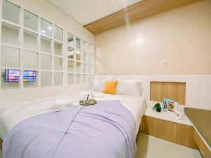 Modern Look 1BR Apartment at Atlanta Residence By Travelio