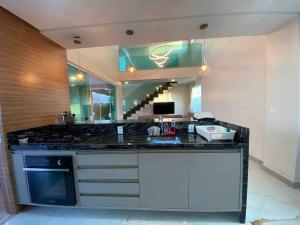 Mansão de luxo em condômino pé na areia