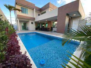 Mansão de luxo em condômino pé na areia